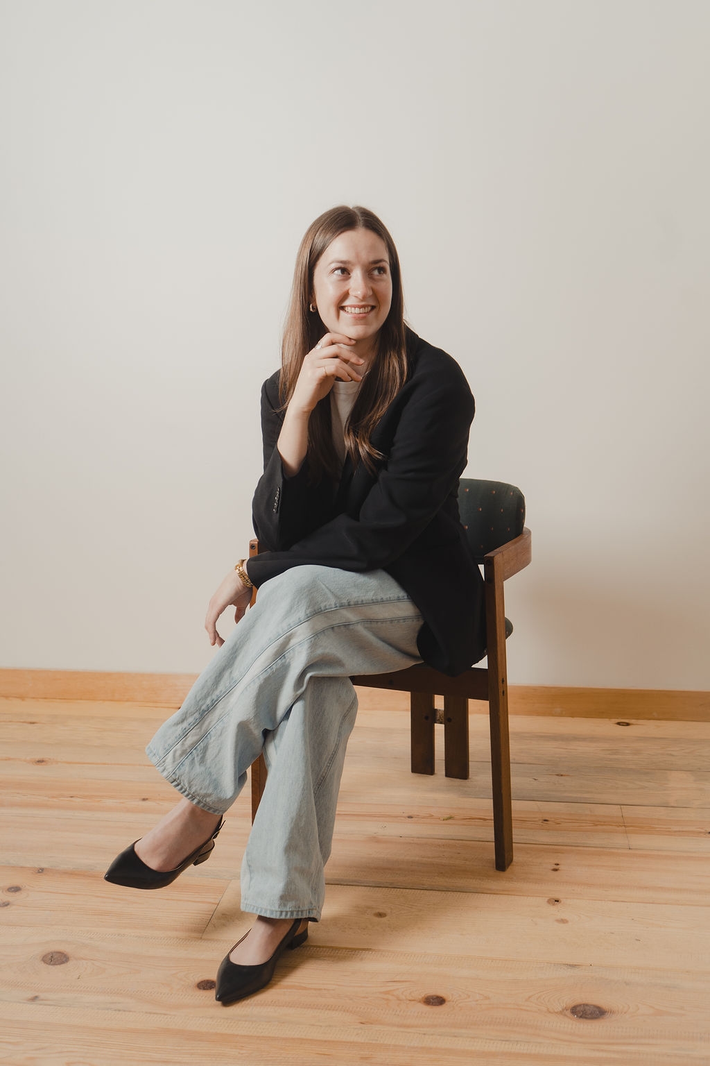 Julia Kee seated in a studio portrait
