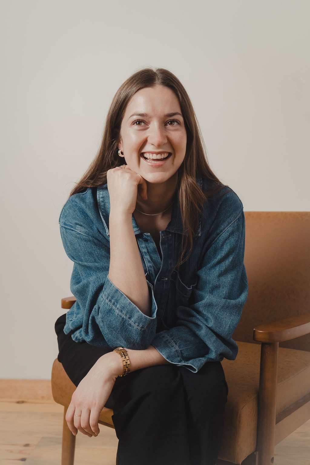 Julia Kee smiling in a studio portrait